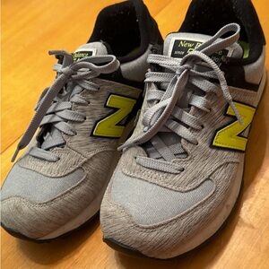 New Balance 574 Gray Sneakers with Yellow Highlights